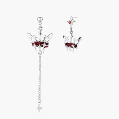 Asymmetrical crown-shaped stud earrings with red zirconia stones, one featuring a silver chain with star charm