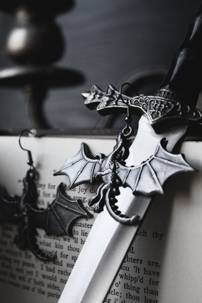 dark dragon motif earrings with flame-inspired detailing