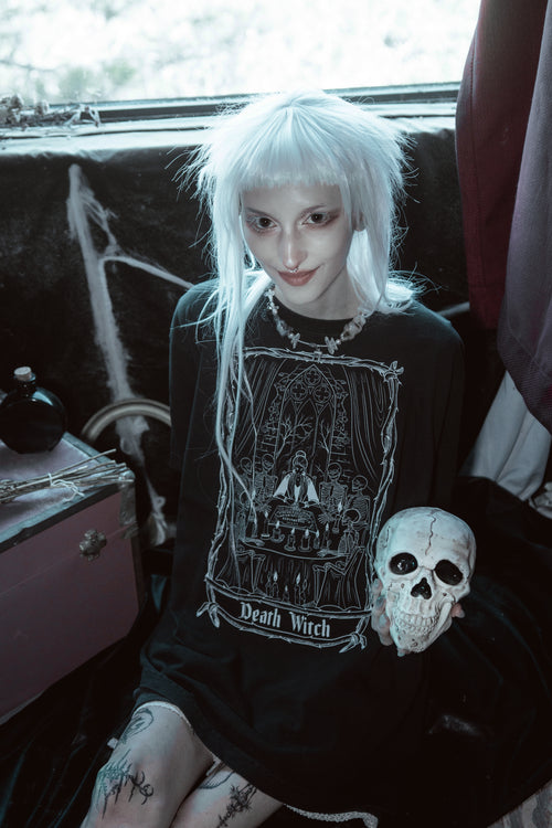 Model wearing the Death Witch Tee with a relaxed fit black cotton t-shirt