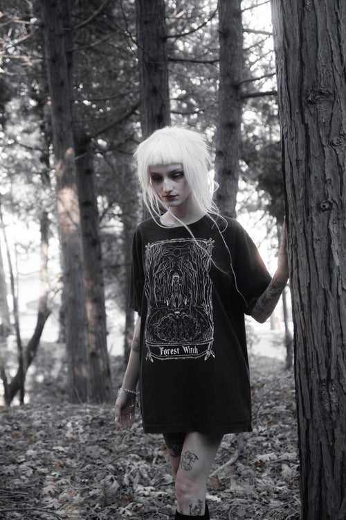 Model styled in the Forest Witch Tee by The Pretty Cult, worn with a casual dark outfit