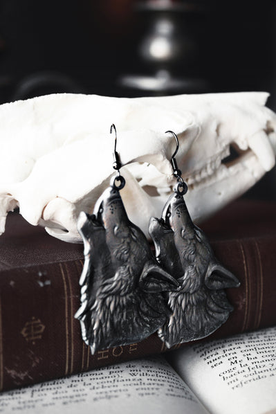 wolf motif dire bound earrings with dark gothic metal detailing