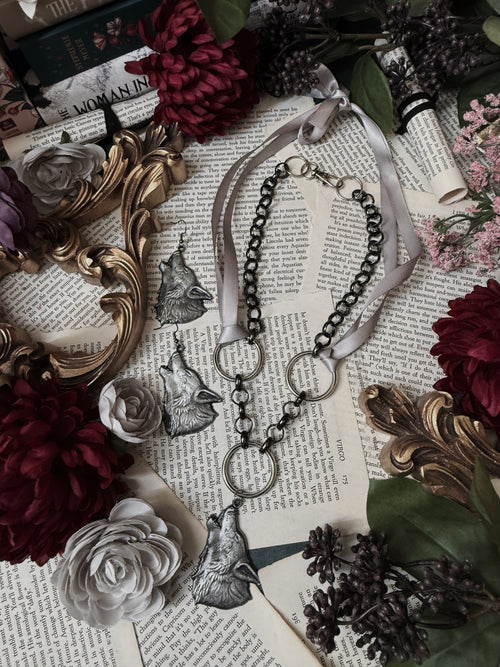 wolf pendant necklace with black ribbon and metal chain layering